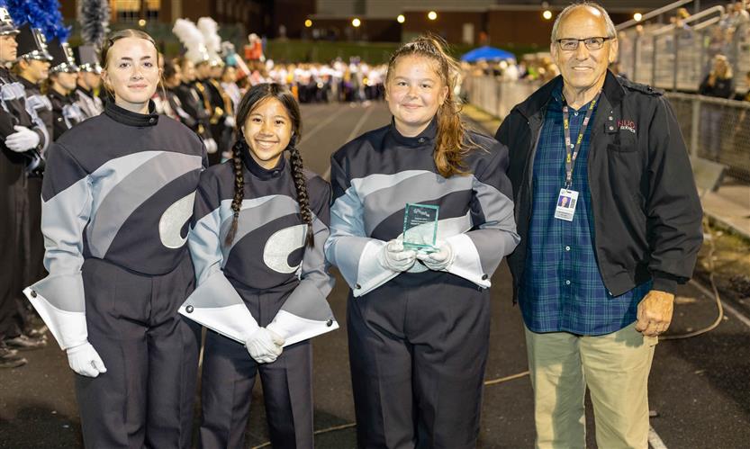 Bands perform on football field